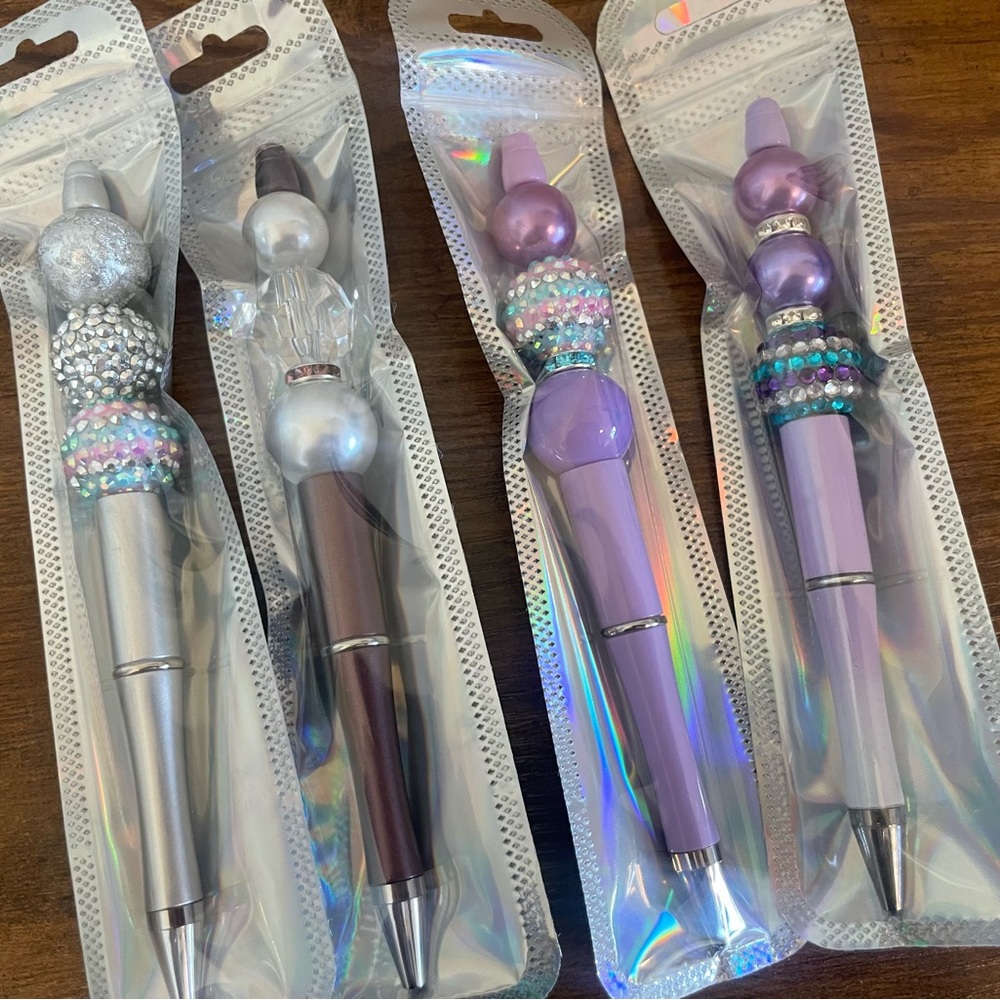 Hand beaded pearlescent pens.